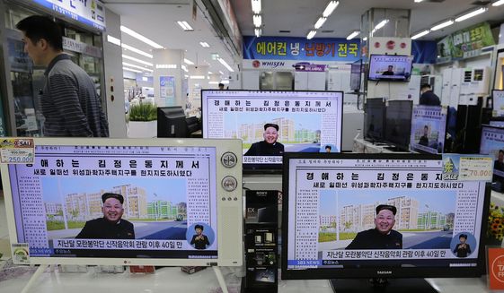 A man walks past TV monitors displaying a news program at an electronic shop in Seoul, South Korea, on Oct. 14, 2014, showing a North Korean newspaper with a photo of North Korean leader Kim Jong Un smiling, reportedly during his first public appearance in five weeks in Pyongyang, North Korea. The writing reads, &amp;quot;Honorable Kim Jong Un.&amp;quot; South Korea plans to lift its decades-long ban on public access to North Korean television, newspapers and other media as part of its efforts to promote mutual understanding between the rivals, officials said Friday, July 22, 2022, despite animosities over the North&#39;s recent missile tests. (AP Photo/Ahn Young-joon, File)