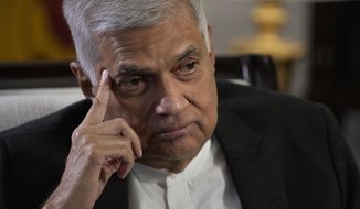 FILE - Sri Lanka&#39;s new Prime Minister Ranil Wickremesinghe gestures during an interview with The Associated Press in Colombo, Sri Lanka, on June 11, 2022. On Friday, July 22, now Sri Lanka&#39;s new president, Wickremesinghe, appointed a classmate and ally of ousted President Gotabaya Rajapaksa to be his prime minister and partner in rescuing the country from its predicament. The question is whether they can muster the political heft and enough support from a public fed up with shortages of food, fuel and medicine to get the job done. (AP Photo/Eranga Jayawardena, File)