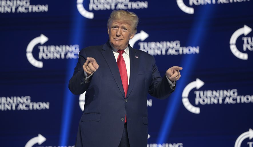 Former President Donald Trump reacts before addressing attendees during the Turning Point USA Student Action Summit, Saturday, July 23, 2022, in Tampa, Fla. (AP Photo/Phelan M. Ebenhack)