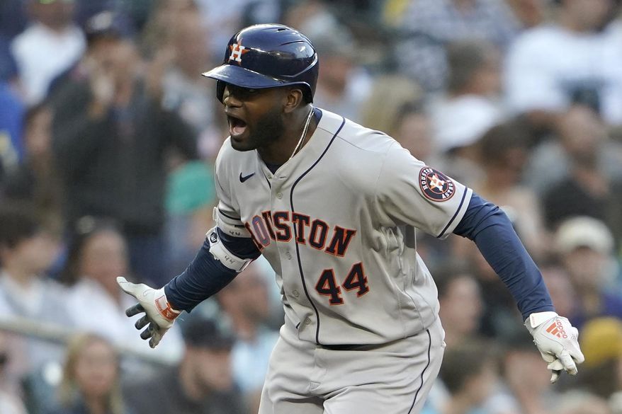 Houston Astros&#39; Yordan Alvarez reacts as he rounds the bases after he hit a solo home run during the fourth inning of a baseball game against the Seattle Mariners, Friday, July 22, 2022, in Seattle. (AP Photo/Ted S. Warren)