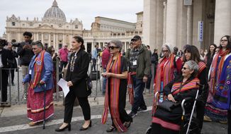 President of the Metis community, Cassidy Caron, second left, and other delegates arrive to speak to the media in St. Peter&#39;s Square after their meeting with Pope Francis at The Vatican, March 28, 2022. Pope Francis’ trip to Canada, which begins Sunday July 24, 2022, to apologize for the horrors of church-run Indigenous residential schools marks a radical rethink of the Catholic Church’s missionary legacy in the Americas, spurred on by the first American pope and the discovery of hundreds of unmarked graves at the school sites. (AP Photo/Gregorio Borgia, File)