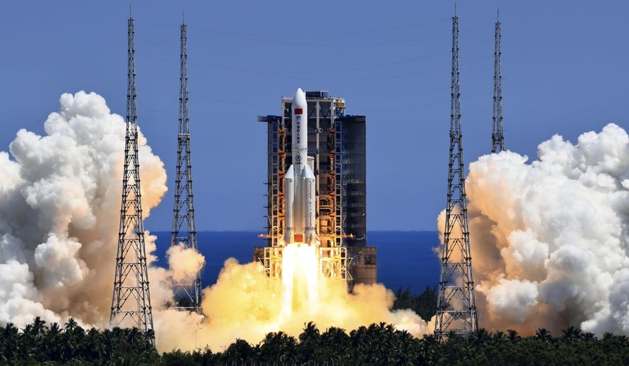 In this photo released by Xinhua News Agency, the Long March 5B Y3 carrier rocket, carrying Wentian lab module blasts off from the Wenchang Space Launch Center in Wenchang in southern China&#x27;s Hainan Province Sunday, July 24, 2022. On a hot Sunday afternoon, with a large crowd of amateur photographers and space enthusiasts watching, China launched the Wentian lab module from tropical Hainan Island. (Li Gang/Xinhua via AP)