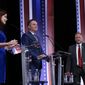 From left, Rebecca Kleefisch, Tim Michels and Timothy Ramthun participate in a televised Wisconsin Republican gubernatorial debate Sunday, July 24, 2022, in Milwaukee. (AP Photo/Morry Gash)