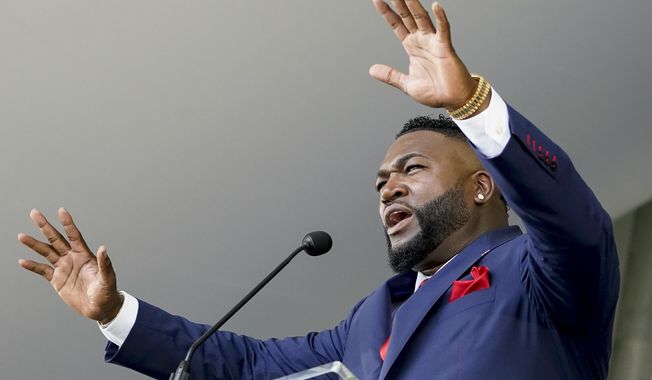Hall of Fame inductee David Ortiz, formerly of the Boston Red Sox baseball team, speaks during the National Baseball Hall of Fame induction ceremony, Sunday, July 24, 2022, in Cooperstown, N.Y. (AP Photo/John Minchillo)