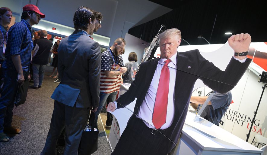 A cardboard sign with the likeness of former President Donald Trump is viewed during the Turning Point USA Student Action Summit, Friday, July 22, 2022, in Tampa, Fla. (AP Photo/Phelan M. Ebenhack)