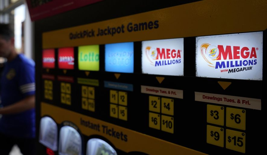 A lottery ticket vending machine sits at a convenience store on July 21, 2022, in Northbrook, Ill. (AP Photo/Nam Y. Huh, File)
