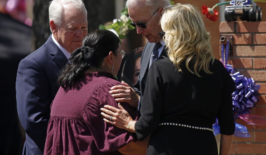 President Joe Biden and first lady Jill Biden comfort principal Mandy Gutierrez as superintendent Hal Harrell stands next to them, at the memorial outside Robb Elementary School to honor the victims killed in this week&#39;s school shooting in Uvalde, Texas, on May 29, 2022. The attorney for the principal of the Texas elementary school where a gunman killed 19 students and two teachers says Gutierrez has been placed on administrative leave on Monday, July 25. (AP Photo/Dario Lopez-Mills, File)