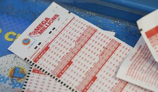Unused lottery tickets can be seen inside a 7-Eleven store in Oakland, Calif., Tuesday, July 26, 2022. (AP Photo/Godofredo A. Vásquez)