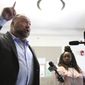 Alex Jones talks to media during a midday break during the trail at the Travis County Courthouse in Austin, Texas, Tuesday, July 26, 2022. (Briana Sanchez/Austin American-Statesman via AP, Pool)