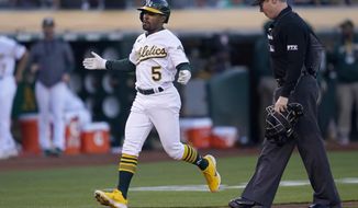 Oakland Athletics&#x27; Tony Kemp (5) reacts after hitting a home run against the Houston Astros during the third inning of a baseball game in Oakland, Calif., Monday, July 25, 2022. (AP Photo/Jeff Chiu)