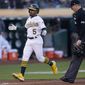 Oakland Athletics&#39; Tony Kemp (5) reacts after hitting a home run against the Houston Astros during the third inning of a baseball game in Oakland, Calif., Monday, July 25, 2022. (AP Photo/Jeff Chiu)