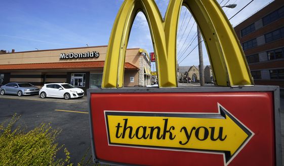 A sign is shown in front of a McDonald&#x27;s restaurant in Pittsburgh on Saturday, April 23, 2022. (AP Photo/Gene J. Puskar) ** FILE **
