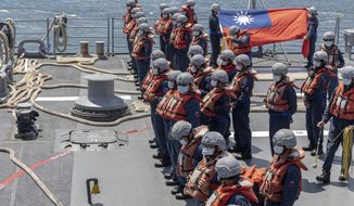 In this photo released by the Taiwan Presidential Office, Taiwan navy personnel form up on a navy ship during the annual Han Kuang exercises in Taiwan on Tuesday, July 26, 2022. (Shioro Lee/Taiwan Presidential Office via AP) **FILE**