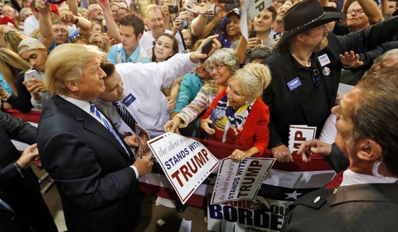 The old Trump magic: Then-Republican presidential hopeful Donald Trump is seen here on the campaign trail during his first bid for the White House, on Oct. 20, 2015. (AP Photo, FIle)
