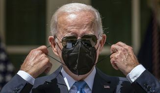 President Joe Biden takes his mask off after recovering from COVID-19 to speak in the Rose Garden of the White House in Washington, Wednesday, July 27, 2022. (AP Photo/Andrew Harnik)