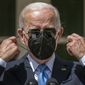 President Joe Biden takes his mask off after recovering from COVID-19 to speak in the Rose Garden of the White House in Washington, Wednesday, July 27, 2022. (AP Photo/Andrew Harnik)