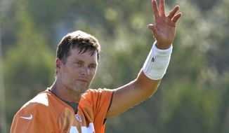 Tampa Bay Buccaneers quarterback Tom Brady waves to the fans during an NFL football training camp practice Wednesday, July 27, 2022, in Tampa, Fla. (AP Photo/Chris O&#39;Meara)