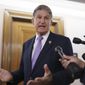 Sen. Joe Manchin, D-W.Va., is met by reporters outside the hearing room where he chairs the Senate Committee on Energy and Natural Resources, at the Capitol in Washington, Thursday, July 21, 2022. (AP Photo/J. Scott Applewhite)