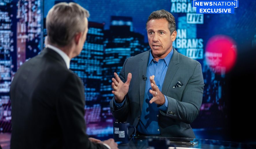 In this image provided by NewsNation, Chris Cuomo answers questions during an interview with Dan Abrams, Tuesday, July 26, 2022, in New York. Cuomo is publicly reemerging following his firing from CNN, starting a YouTube news show and joining NewsNation&#x27;s lineup in the fall. (NewsNation via AP)