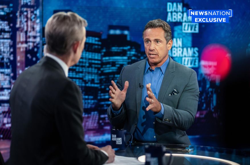 In this image provided by NewsNation, Chris Cuomo answers questions during an interview with Dan Abrams, Tuesday, July 26, 2022, in New York. Cuomo is publicly reemerging following his firing from CNN, starting a YouTube news show and joining NewsNation&#39;s lineup in the fall. (NewsNation via AP)