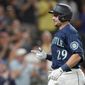 Seattle Mariners&#39; Cal Raleigh reacts after crossing the plate after he hit a solo home run against the Texas Rangers during the seventh inning of a baseball game, Tuesday, July 26, 2022, in Seattle. (AP Photo/Ted S. Warren)