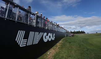 Fans await the final grouping at the 18th hole during the third round of the Portland Invitational LIV Golf tournament in North Plains, Ore., Saturday, July 2, 2022. (AP Photo/Steve Dipaola) **FILE**