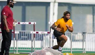 Washington Commanders defensive end Chase Young works during practice at the team&#39;s NFL football training facility, Thursday, July 28, 2022 in Ashburn, Va. (AP Photo/Alex Brandon)