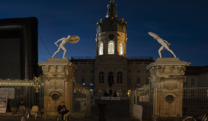 Charlottenburg Palace is in the dark at night in Berlin, Germany, Thursday, July 28, 2022. This is the country&#39;s way of saving energy - one of the consequences of the war in Ukraine. (Paul Zinken/dpa via AP)