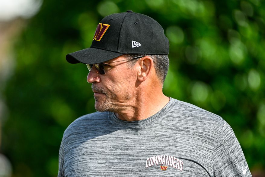 Washington Commanders head coach Ron Rivera heads to the practice field on the second day of training camp at The Park, Ashburn, VA, July 28, 2022. (Photo by Brian Murphy)
