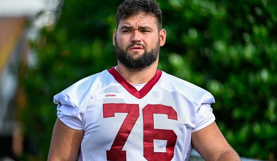Washington Commanders offensive lineman Sam Cosmi (76) heads to the practice field on the second day of training camp at The Park, Ashburn, VA, July 28, 2022. (Photo by Brian Murphy)