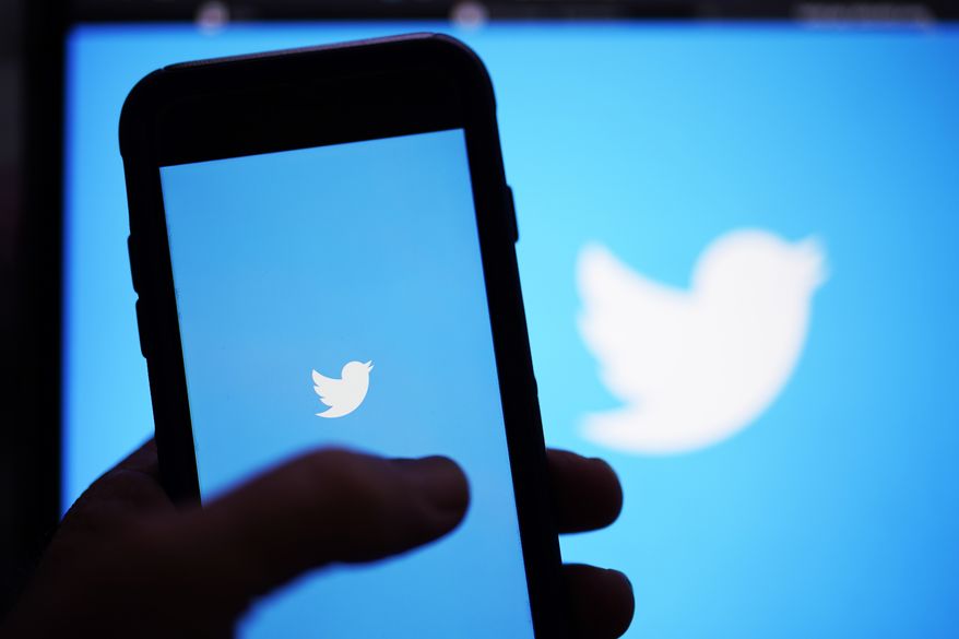 The Twitter application is seen on a digital device, April 25, 2022, in San Diego. Twitter warned Thursday, July 28, that governments around the globe are asking the company to remove content or snoop on private details of user accounts at an alarming rate. (AP Photo/Gregory Bull, File)