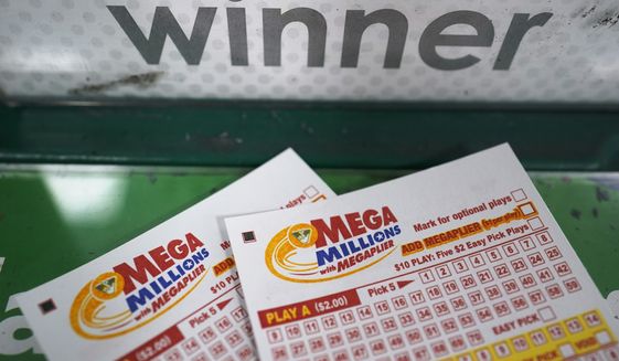 Mega Millions play slips are displayed on a gaming kiosk for tonight&#39;s Mega Millions lottery drawing at a convince store Friday July 29, 2022, in Ashland, Va. (AP Photo/Steve Helber)