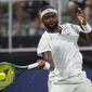 Frances Tiafoe, of the United States, returns the ball to countryman Jenson Brooksby during a semifinal at the Atlanta Open tennis tournament Saturday, July 30, 2022, in Atlanta. (AP Photo/Hakim Wright Sr.)
