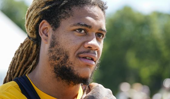 Washington Commanders defensive end Chase Young (99) speaks with reporters after practice at the team&#39;s NFL football training facility, Saturday, July 30, 2022 in Ashburn, Va. (AP Photo/Alex Brandon)