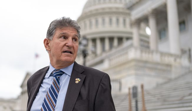 Sen. Joe Manchin, D-W.Va., departs as the Senate breaks for the Memorial Day recess, at the Capitol in Washington, May 26, 2022. A Democratic economic package focused on climate and health care faces hurdles but seems headed toward party-line passage by Congress next month. Senate Majority Leader Chuck Schumer, D-N.Y., crafted a compromise package with Manchin, to the surprise of everyone, transforming the West Virginian from pariah to partner. (AP Photo/J. Scott Applewhite, File)