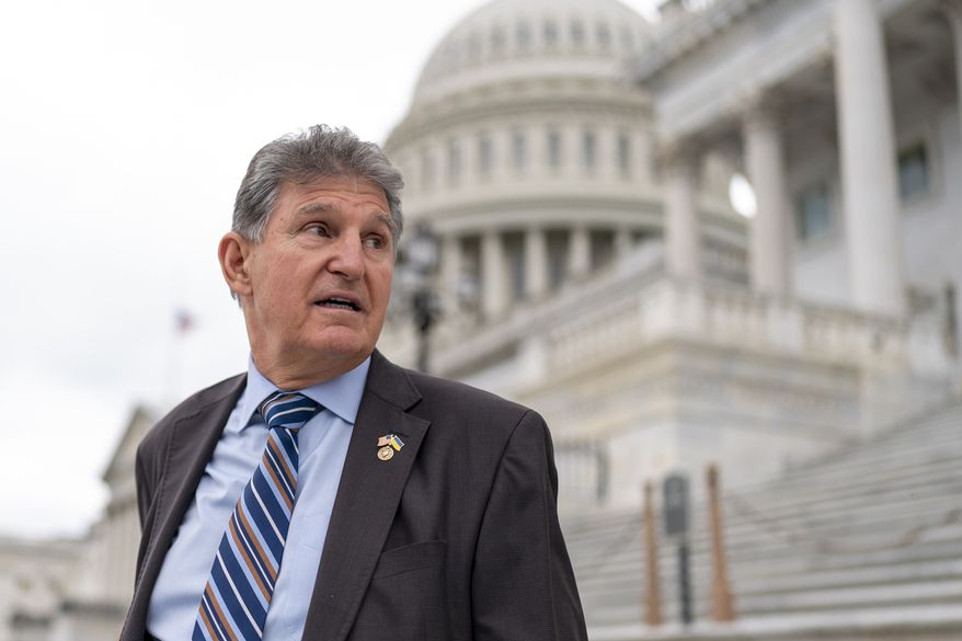 Sen. Joe Manchin, D-W.Va., departs as the Senate breaks for the Memorial Day recess, at the Capitol in Washington, May 26, 2022. A Democratic economic package focused on climate and health care faces hurdles but seems headed toward party-line passage by Congress next month. Senate Majority Leader Chuck Schumer, D-N.Y., crafted a compromise package with Manchin, to the surprise of everyone, transforming the West Virginian from pariah to partner. (AP Photo/J. Scott Applewhite, File)