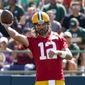 Green Bay Packers&#39; Aaron Rodgers runs a drill at the NFL football team&#39;s practice field Saturday, July 30, 2022, in Green Bay, Wis. (AP Photo/Morry Gash)