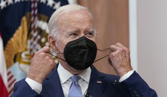 President Joe Biden removes his face mask as he arrives to speak about the economy during a meeting with CEOs in the South Court Auditorium on the White House complex in Washington, Thursday, July 28, 2022. Biden tested positive for COVID-19 again Saturday, July 30, slightly more than three days after he was cleared to exit coronavirus isolation, the White House said, in a rare case of “rebound” following treatment with an anti-viral drug. (AP Photo/Susan Walsh) **FILE**