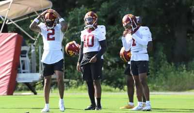 Washington Commanders&#39; Dyami Brown (2), Jahan Dotson (1) and Curtis Samuel (10) chatting before the start of practice while at Day 4 of Training Camp at The Park in Ashburn, VA on July 30th 2022 (Photo: Alyssa Howell)(