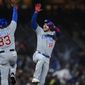 Chicago Cubs&#39; Patrick Wisdom (16) celebrates with third base coach Willie Harris (33) after hitting a solo home run against the San Francisco Giants during the fifth inning of a baseball game in San Francisco, Friday, July 29, 2022. (AP Photo/Godofredo A. Vásquez)
