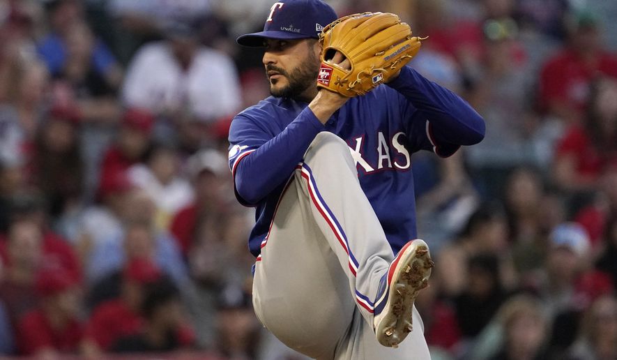 Texas Rangers starting pitcher Martin Perez throws to the plate during the fourth inning of a baseball game against the Los Angeles Angels Friday, July 29, 2022, in Anaheim, Calif. (AP Photo/Mark J. Terrill)