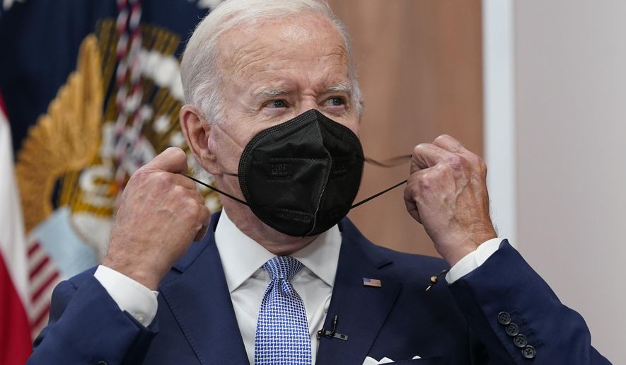 President Joe Biden removes his face mask as he arrives to speak about the economy during a meeting with CEOs in the South Court Auditorium on the White House complex in Washington, Thursday, July 28, 2022. Biden tested positive for COVID-19 again Saturday, July 30, slightly more than three days after he was cleared to exit coronavirus isolation, the White House said, in a rare case of “rebound” following treatment with an anti-viral drug. (AP Photo/Susan Walsh, File)
