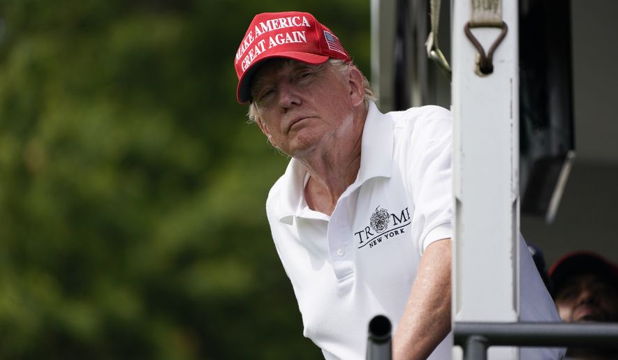 Former President Donald Trump interacts with the crowd during the final round of the Bedminster Invitational LIV Golf tournament in Bedminster, N.J., Sunday, July 31, 2022. (AP Photo/Seth Wenig)