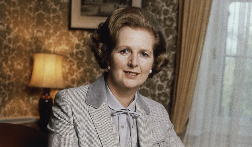 FILE - British Prime Minister Margaret Thatcher poses for a photo in this 1980 photo. Two people are running to be Britain’s next prime minister, but a third presence looms over the contest: Margaret Thatcher. Almost a decade after her death, the late former prime minister casts a powerful spell over Britain's Conservative Party. In the race to replace Boris Johnson as Conservative leader and prime minister, both Foreign Secretary Liz Truss and former Treasury chief Rishi Sunak claim to embody the values of Thatcher. (AP Photo/File)
