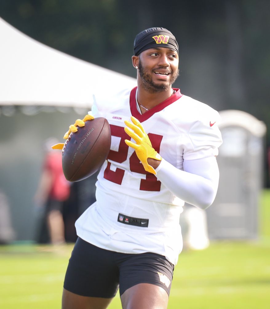 Washington Commanders Running Back Antonio Gibson (24) walking on the field before practice at Day 5 of Training Camp at The Park in Ashburn VA on August 1st 2022. (Photo: Alyssa Howell)