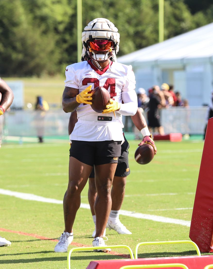 Washington Commanders Running Back Antonio Gibson (24) getting instructions on how to run through an obstacle at Day 5 of Training Camp at The Park in Ashburn VA on August 1st 2022. (Photo: Alyssa Howell)