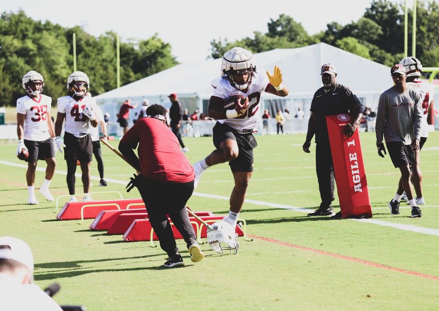 Washington Commanders Running Back Jaret Patterson (32) running through an obstacle at Day 5 of Training Camp at The Park in Ashburn VA on August 1st 2022. (Photo: Alyssa Howell)