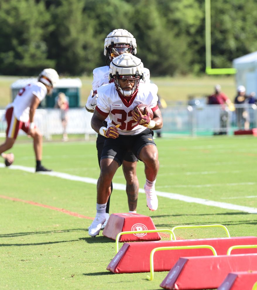 Washington Commanders Running Back Jaret Patterson (32) running through an obstacle at Day 5 of Training Camp at The Park in Ashburn VA on August 1st 2022. (Photo: Alyssa Howell)