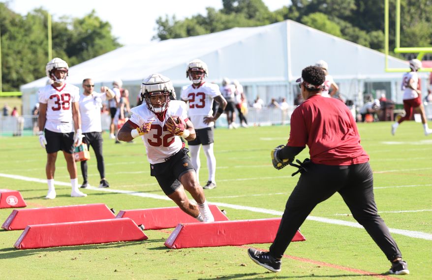 Washington Commanders Running Back Jaret Patterson (32) running through an obstacle at Day 5 of Training Camp at The Park in Ashburn VA on August 1st 2022. (Photo: Alyssa Howell)