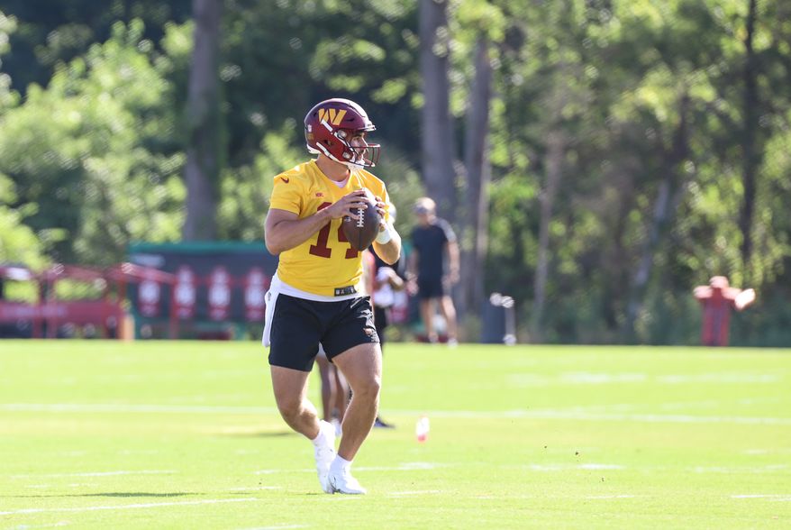 Washington Commanders Quarterback Sam Howell (14) about to make a throw at Day 5 of Training Camp at The Park in Ashburn VA on August 1st 2022. (Photo: Alyssa Howell)